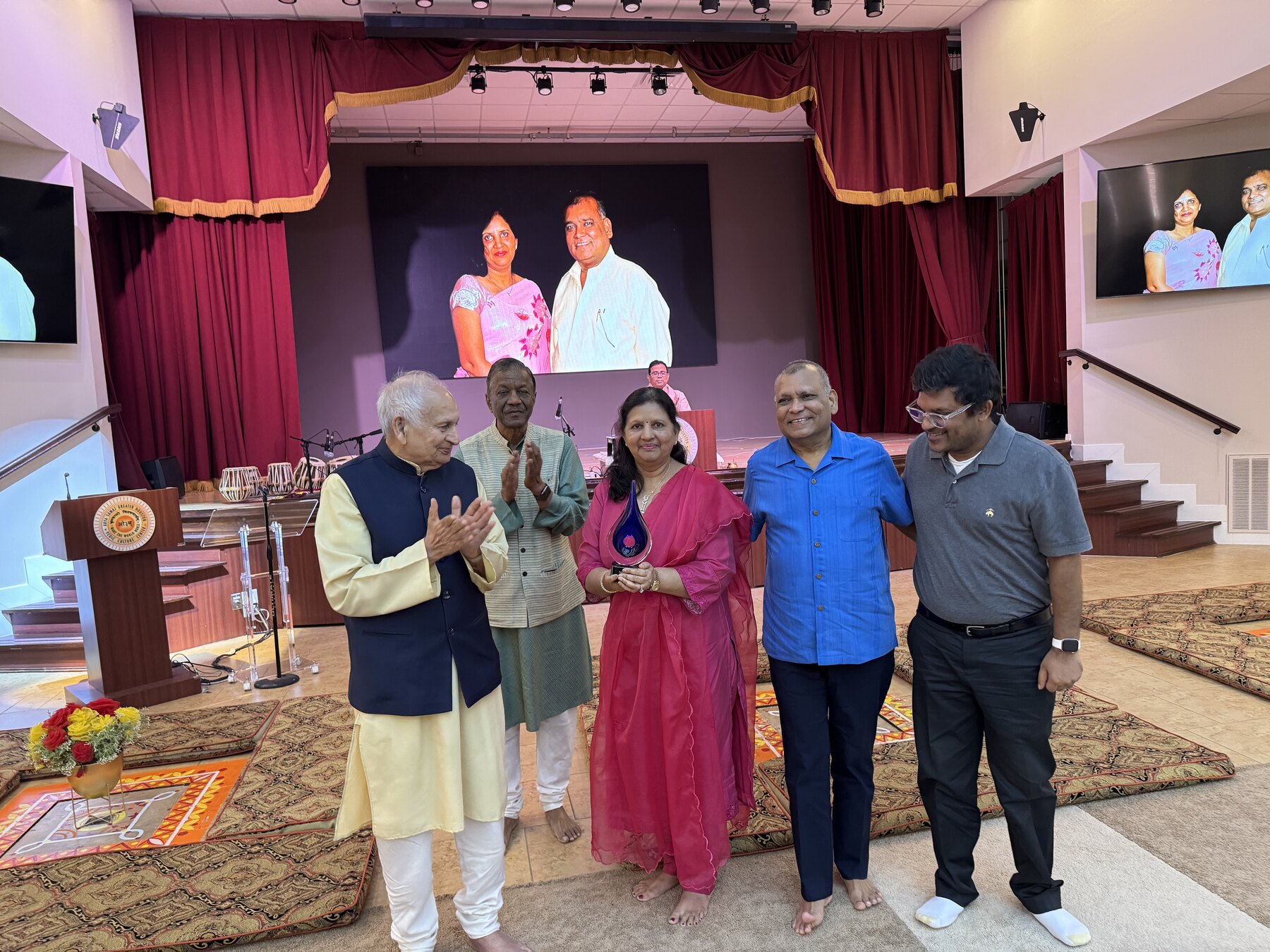 Brij and Sunita Agrawal at an Arya Samaj of Greater Houston recognition event with family and community leaders